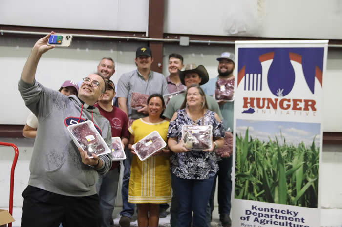 Commissioner Quarles joins Father Jim Sichko and others for a ground beef donation