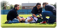 Emergency responders and students treat a 