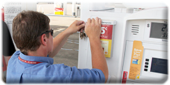 Tracee Brewer opens a gas pump